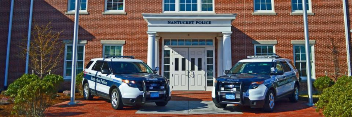 Nantucket Police Cruisers in Front of Building